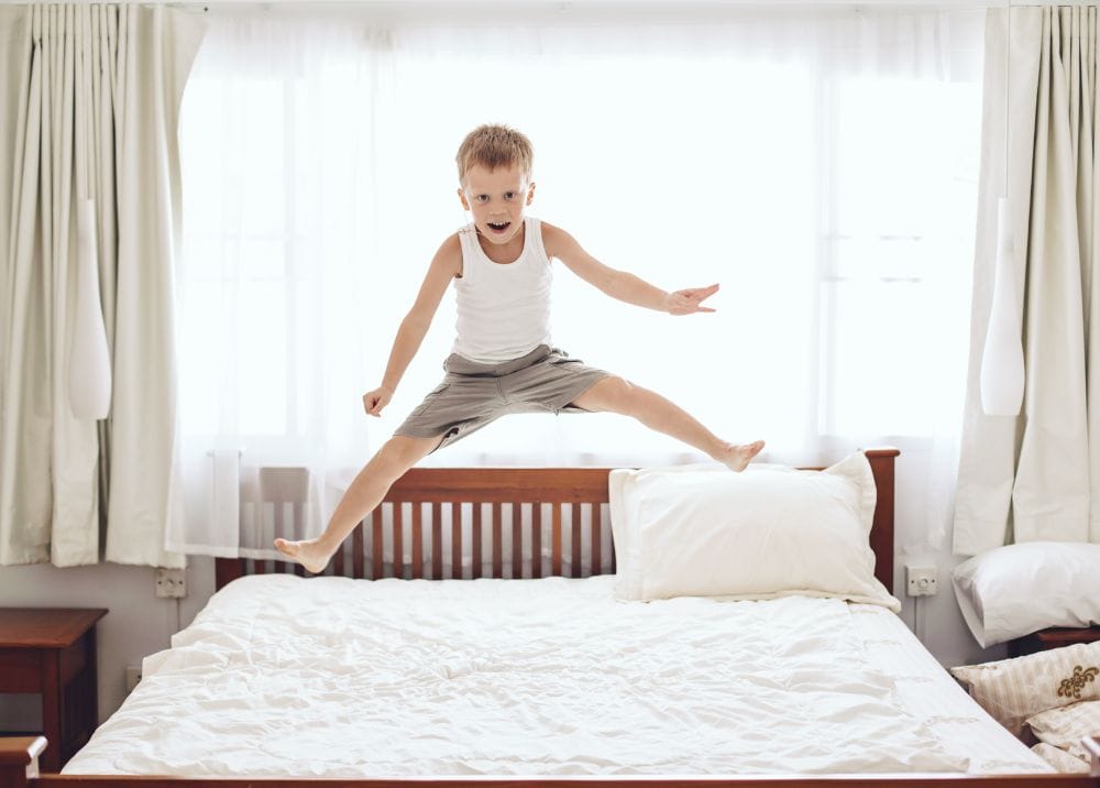 Kid Jumping on Bed